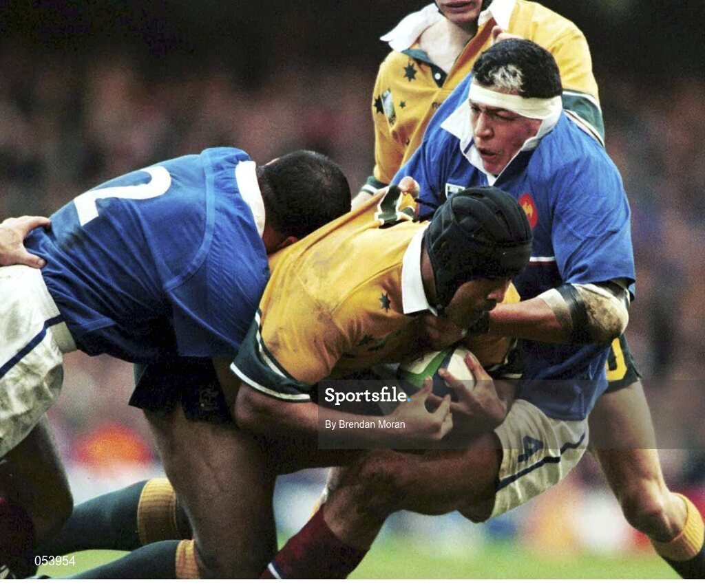6 November 1999; Stephen Larkham, Australia, in action against Raphael Ibanez, 2, and Abdelatif Benazzi, France. 1999 Rugby World Cup Final, Australia v France, Millennium Stadium, Cardiff, Wales. Picture credit: Brendan Moran / SPORTSFILE