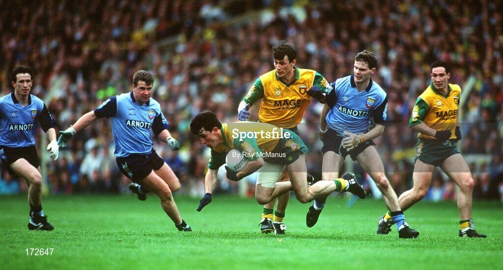 9 May 1993; Barry McGowan of Donagal supported by team-mates John Joe Doherty and Donal Reid, right, in action against Niall Guiden, left, Charlie Redmond, centre, and Martin Doran of Dublin during the Royal Liver Assurance National Football League Final Replay match between Dublin and Donegal at Croke Park, Dublin. Photo by Ray McManus/Sportsfile