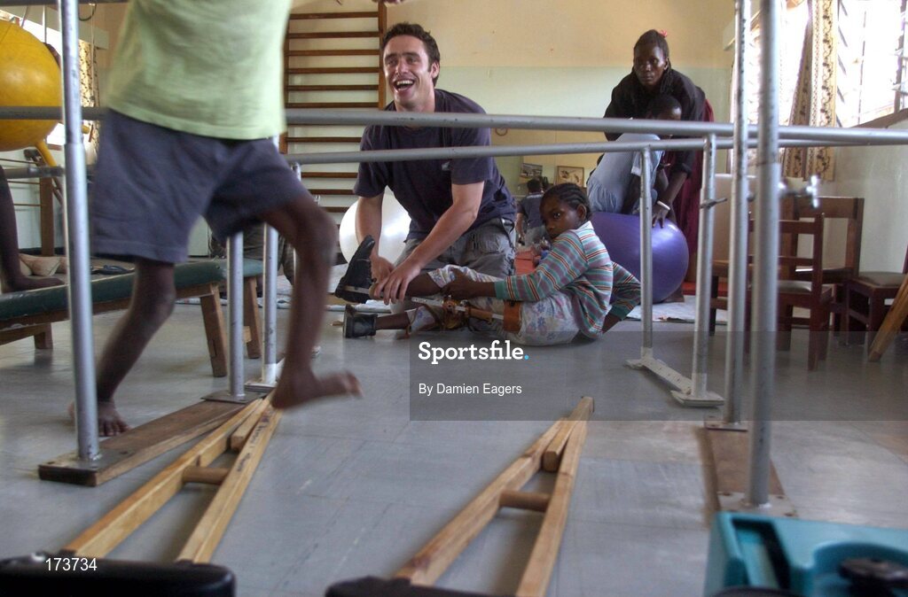 25 February 2005; Galway's Alan Kerins with children during a physiotherapy session. Cheshire home for the physically challenged children, Mongu, Zambia. Picture credit; Damien Eagers / SPORTSFILE