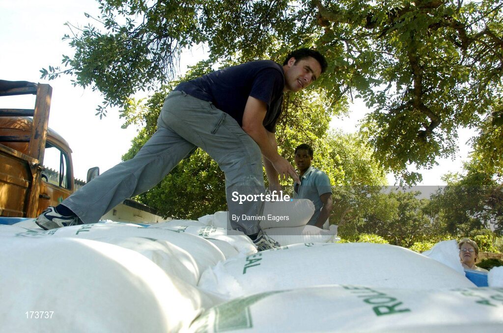 25 February 2005; Galway's Alan Kerins loads bags of Mealie Meal as part of the Presentation Sisters Famine Relief project. Cheshire home for the physically challenged children, Mongu, Zambia. Picture credit; Damien Eagers / SPORTSFILE