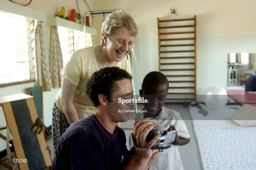 25 February 2005; Galway's Alan Kerins with Presentation Sister Stella and Albert watch a video of Albert talking. Cheshire home for the physically challenged children, Mongu, Zambia. Picture credit; Damien Eagers / SPORTSFILE