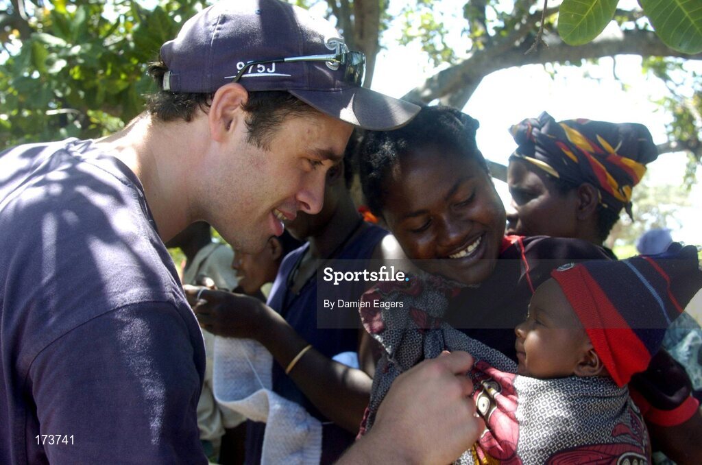 25 February 2005; Local women and children from Katoya greet Galway's Alan Kerins as bags of Mealie Meal arrive as part of the Presentation sisters Famine Relief project. Cheshire home for the physically challenged children, Mongu, Zambia. Picture credit; Damien Eagers / SPORTSFILE