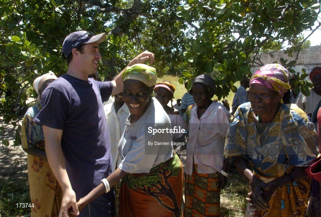 25 February 2005; Local women from Kataya greet Galway's Alan Kerins as bags of Mealie Meal arrive as part of the Presentation sisters Famine Relief project. Cheshire home for the physically challenged children, Mongu, Zambia. Picture credit; Damien Eagers / SPORTSFILE