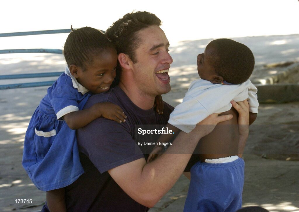 25 February 2005; Galway's Alan Kerins with Mwiya, right, and Dolan. Cheshire home for the physically challenged children, Mongu, Zambia. Picture credit; Damien Eagers / SPORTSFILE