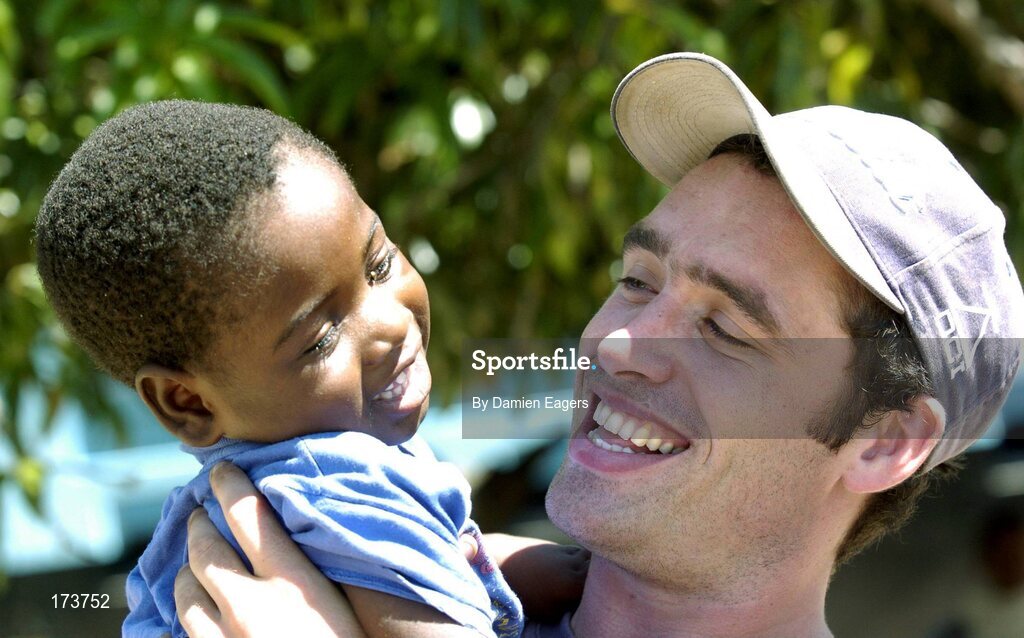 25 February 2005; Galway's Alan Kerins with Mwiya. Cheshire home for the physically challenged children, Mongu, Zambia. Picture credit; Damien Eagers / SPORTSFILE
