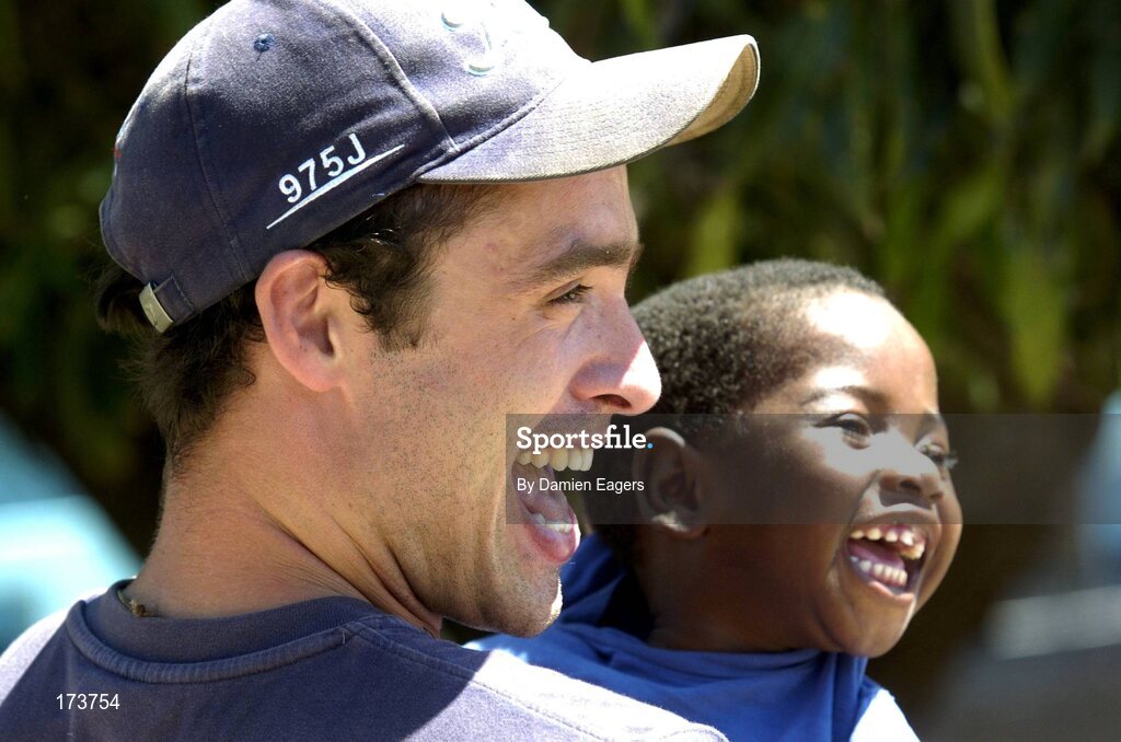 25 February 2005; Galway's Alan Kerins with Mwiya. Cheshire home for the physically challenged children, Mongu, Zambia. Picture credit; Damien Eagers / SPORTSFILE