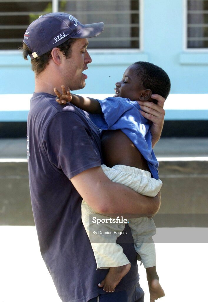 25 February 2005; Galway's Alan Kerins with Mwiya. Cheshire home for the physically challenged children, Mongu, Zambia. Picture credit; Damien Eagers / SPORTSFILE