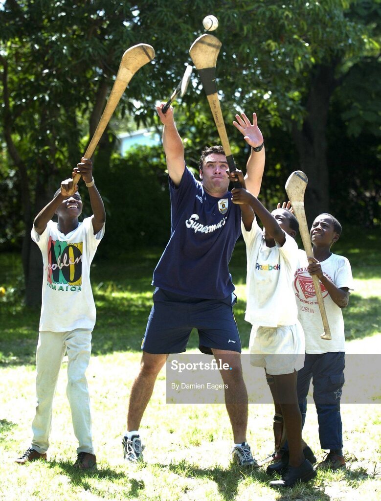 25 February 2005; Galway's Alan Kerins plays hurling with local children Namatimbo, left, Simona and Mumbuwa right. Cheshire home for the physically challenged children, Mongu, Zambia. Picture credit; Damien Eagers / SPORTSFILE