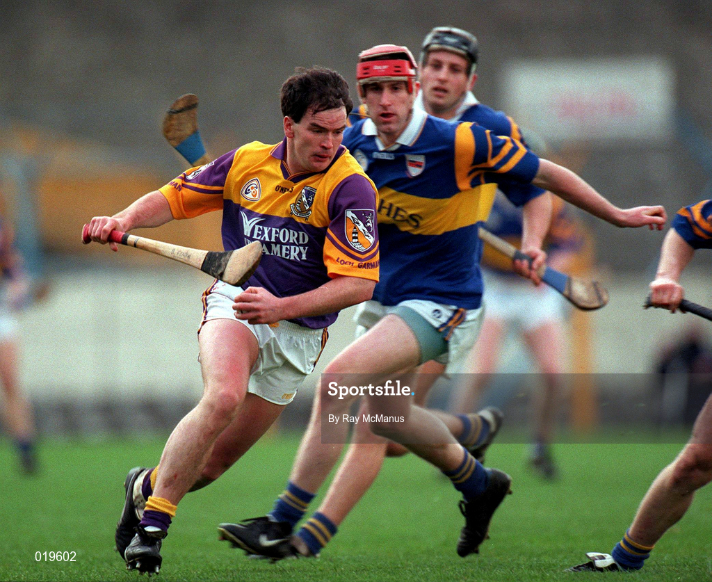 21 March 1999; Adrian Fenlon of Wexford in action against Paul Ormonde of Tipperary during the Church and General National Hurling League Division 1B match between Tipperary and Wexford at Semple Stadium in Thurles, Tipperary. Photo by Ray McManus/Sportsfile