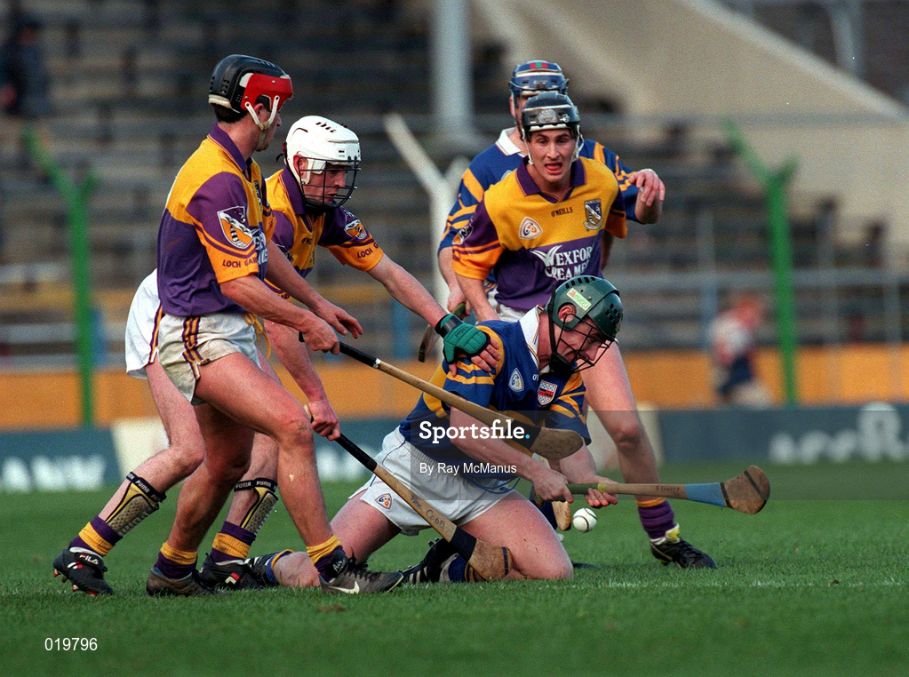 21 March 1999; David Kennedy of Tipperary in action against Ryan Quigley, left, Paul Codd, centre, and Rory McCarthy of Wexford during the Church and General National Hurling League Division 1B match between Tipperary and Wexford at Semple Stadium in Thurles, Tipperary. Photo by Ray McManus/Sportsfile