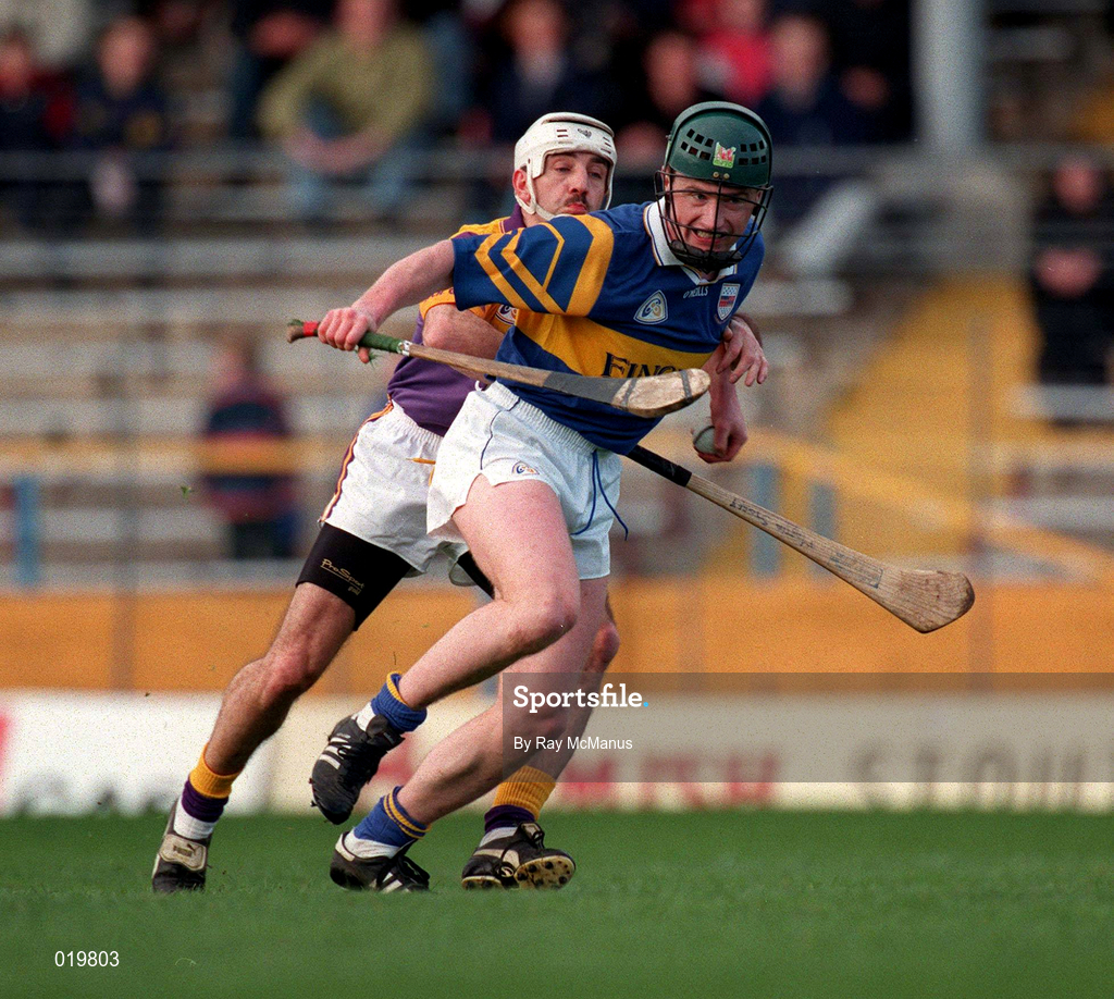 21 March 1999; David Kennedy of Tipperary in action against Martin Storey of Wexford during the Church and General National Hurling League Division 1B match between Tipperary and Wexford at Semple Stadium in Thurles, Tipperary. Photo by Ray McManus/Sportsfile