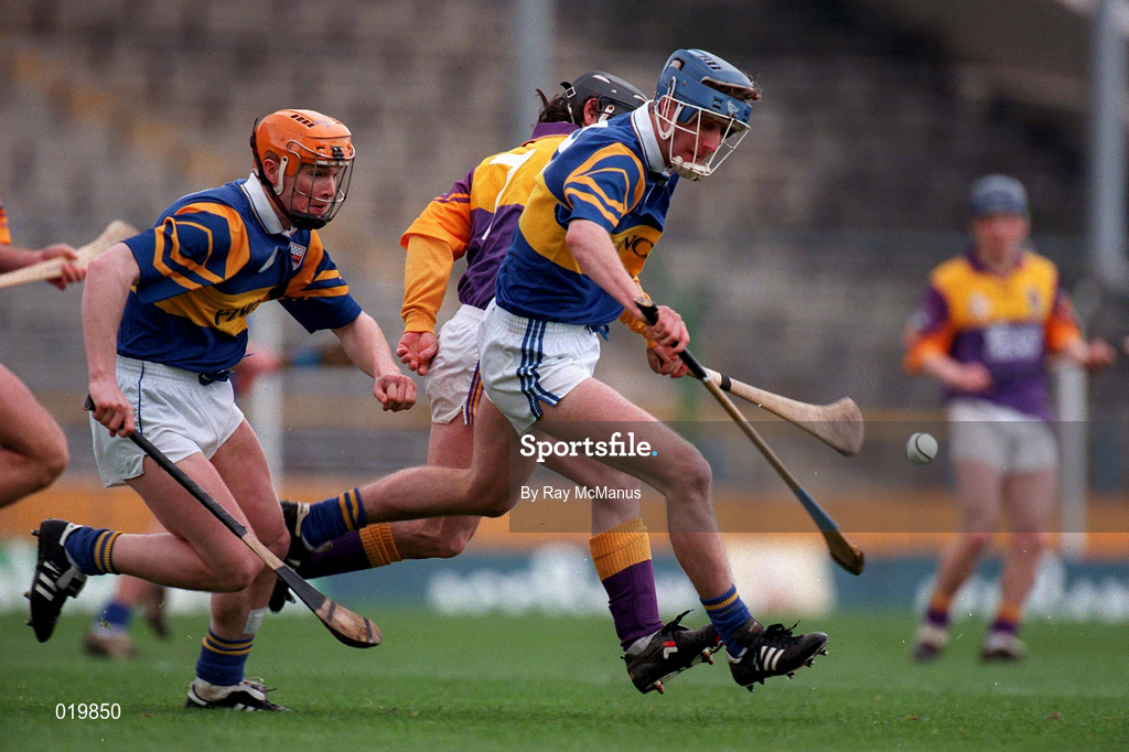21 March 1999; Eddie Enright of Tipperary in action against Sean Flood of Wexford during the Church and General National Hurling League Division 1B match between Tipperary and Wexford at Semple Stadium in Thurles, Tipperary. Photo by Ray McManus/Sportsfile