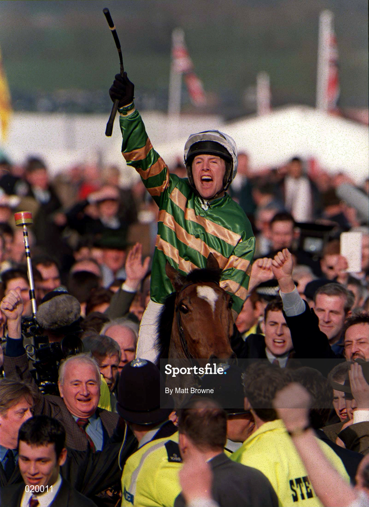 16 March 1999; Jockey Charlie Swan celebrates on Istabraq after winning the Smurfit Champion Hurdle Challenge Trophy during day one of the Cheltenham Racing Festival at Prestbury Park in Cheltenham, England. Photo by Matt Browne/Sportsfile