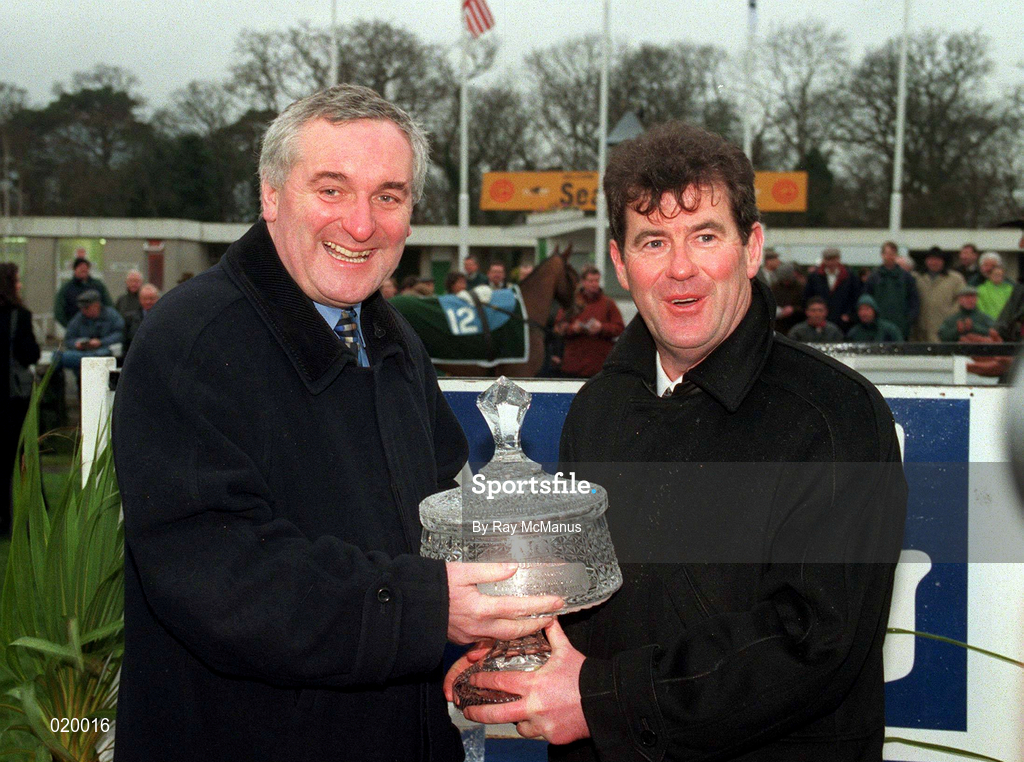 24 January 1999; Owner JP McManus, is presented with the AIG Championship Hurdle trophy by An Taoiseach Bertie Ahern after sending out Istabraq to win at Leopardstown Racecourse in Dublin. Photo by Ray McManus/Sportsfile