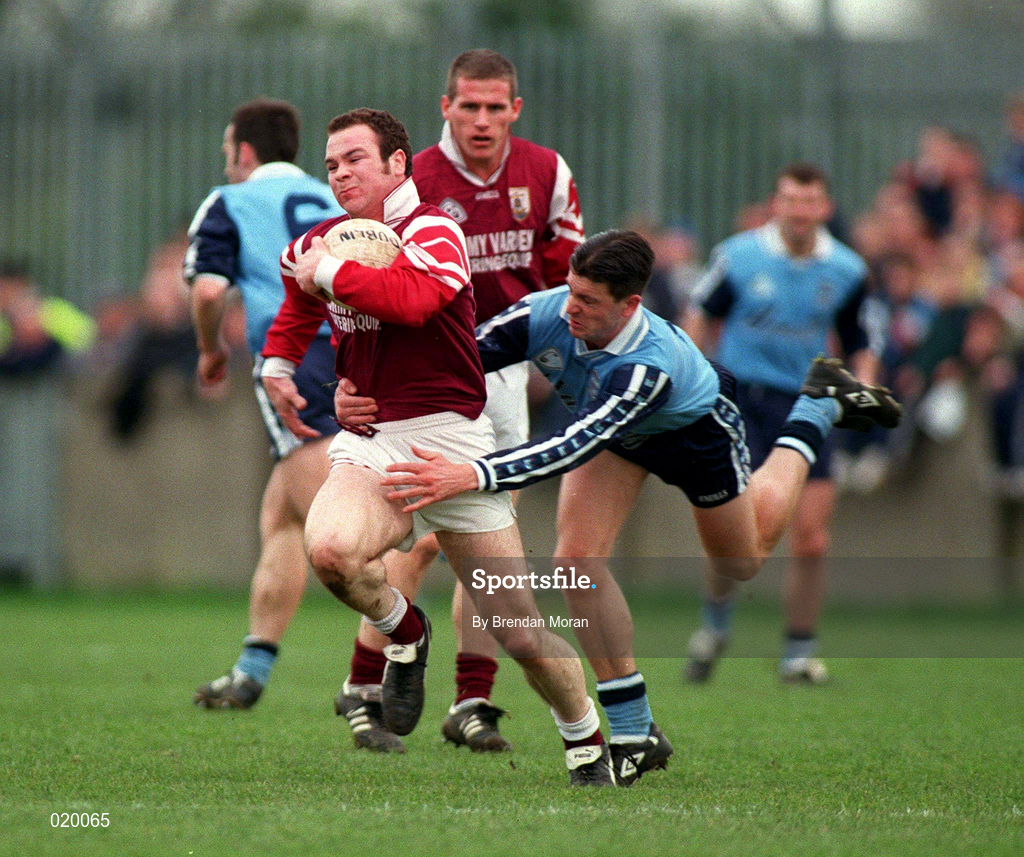 14 March 1999; John Divilly of Galway is tackled by Senan Connell of Dublin during the Church and General National Football League Division 1 match between Dublin and Galway at Parnell Park in Dublin. Photo by Brendan Moran/Sportsfile