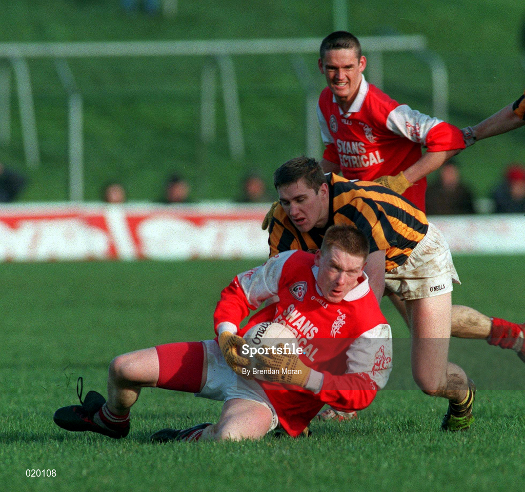 21 February 1999; Kevin Haughney of Éire Og in action against Tony McEntee of Crossmaglen Rangers during the AIB All-Ireland Senior Club Football Championship Semi-Final match between Crossmaglen Rangers and Éire Og at Páirc Tailteann in Navan, Meath. Photo by Brendan Moran/Sportsfile