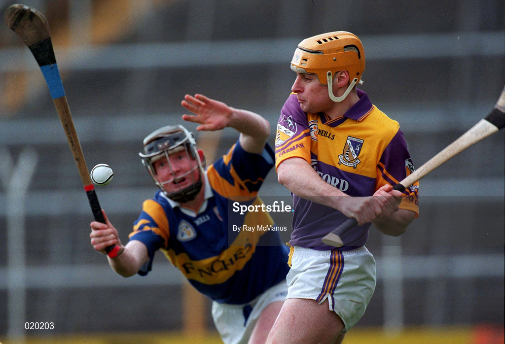 21 March 1999; Michael Jordan of Wexford in action against Eamon Corcoran of Tipperary during the Church and General National Hurling League Division 1B match between Tipperary and Wexford at Semple Stadium in Thurles, Tipperary. Photo by Ray McManus/Sportsfile