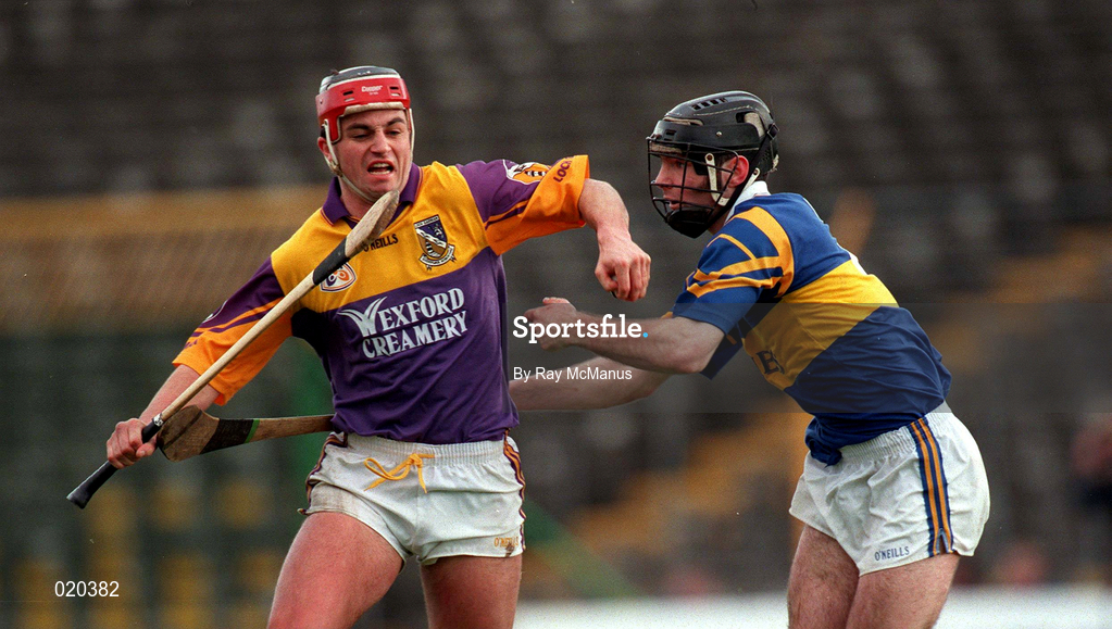 21 March 1999; Ryan Quigley of Wexford in action against Donnacha Fahy of Tipperary during the Church and General National Hurling League Division 1B match between Tipperary and Wexford at Semple Stadium in Thurles, Tipperary. Photo by Ray McManus/Sportsfile