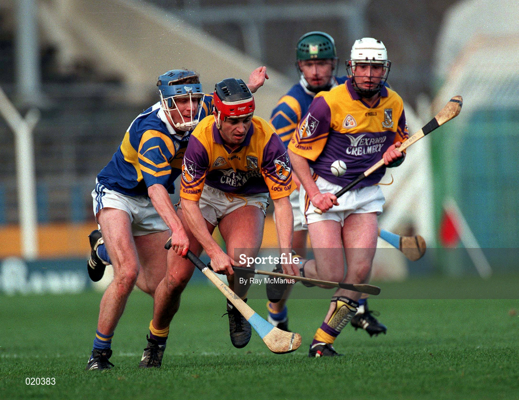 21 March 1999; Ryan Quigley of Wexford in action against Eddie Enright of Tipperary during the Church and General National Hurling League Division 1B match between Tipperary and Wexford at Semple Stadium in Thurles, Tipperary. Photo by Ray McManus/Sportsfile