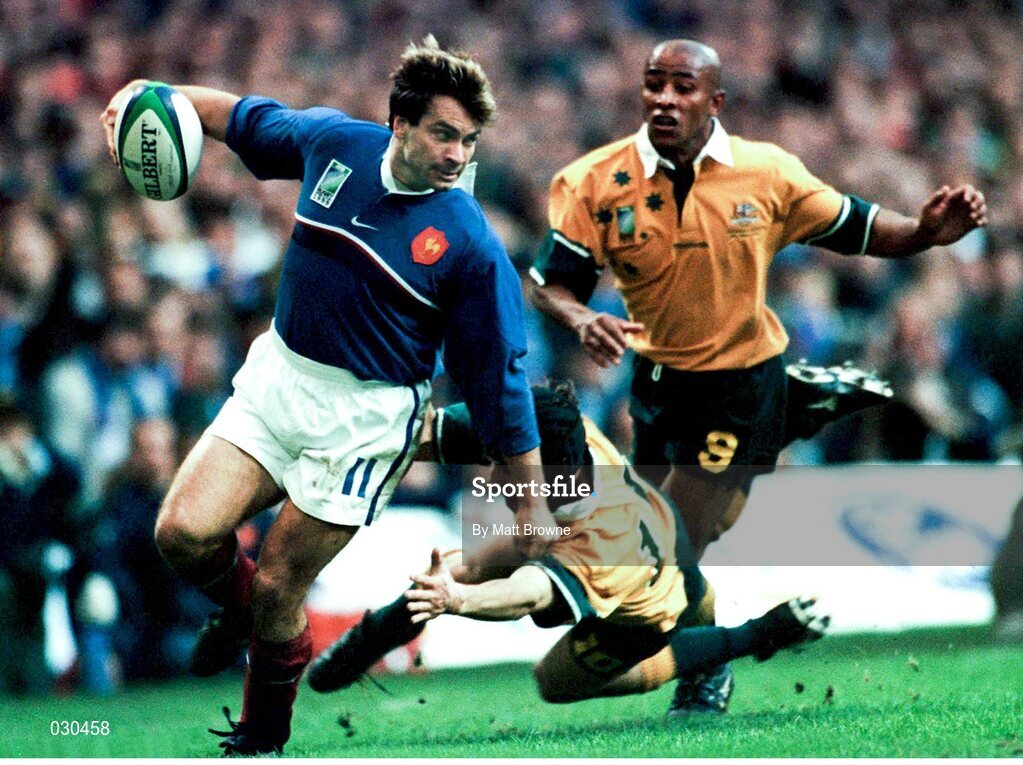 6 November 1999; Christophe Dominici, France, in action against Stephen Larkham, Australia. 1999 Rugby World Cup, Australia v France, Millennium Stadium, Cardiff, Wales. Picture credit: Matt Browne / SPORTSFILE