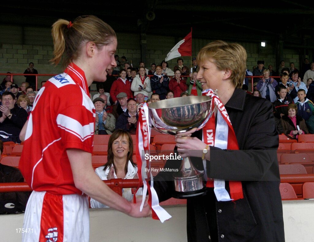 30 April 2005; Cork captain Juliette Murphy is presented with the trophy by Geraldine Giles, President, Cumann Peil Gael na mBan. Suzuki Ladies National Football League, Division 1 Final, Cork v Galway, Gaelic Grounds, Limerick. Picture credit; Ray McManus / SPORTSFILE