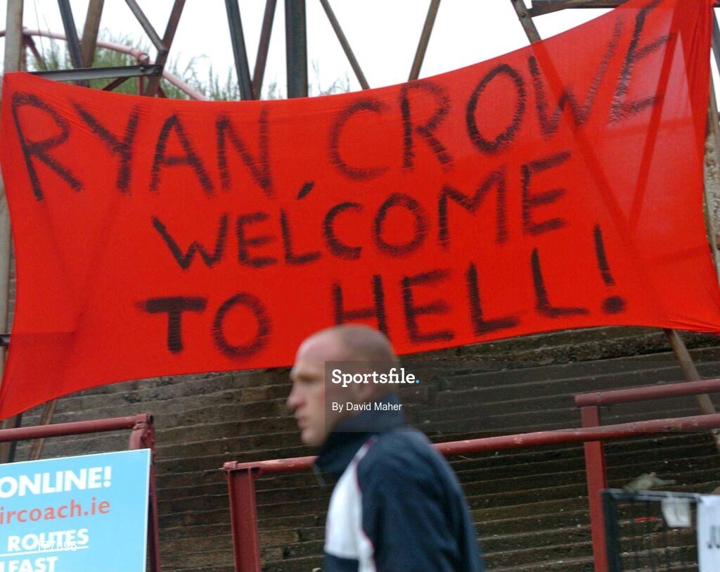 27 May 2005; Glen Crowe, Shelbourne, walks passed a flag erected by the Bohemians supporters before the start of the game. eircom League, Premier Division, Bohemians v Shelbourne, Dalymount Park, Dublin. Picture credit; David Maher / SPORTSFILE