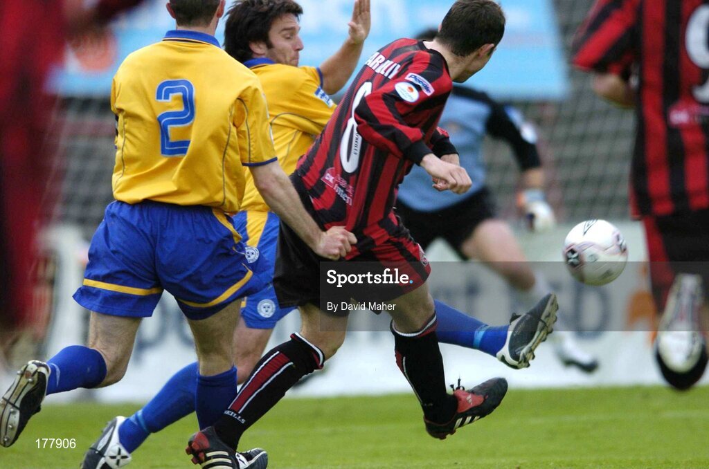 27 May 2005; Gareth Farrelly, Bohemians, beats Stuart Byrne, Shelbourne, to score his sides first goal. eircom League, Premier Division, Bohemians v Shelbourne, Dalymount Park, Dublin. Picture credit; David Maher / SPORTSFILE