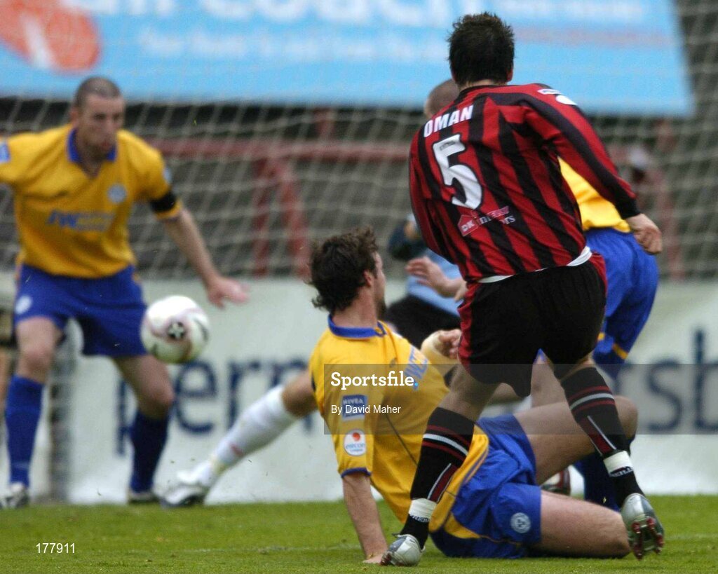 27 May 2005; Ken Oman, Bohemians, beats Shelbourne players Owen Heary, right, and Jamie Harris, to score his sides second goal. eircom League, Premier Division, Bohemians v Shelbourne, Dalymount Park, Dublin. Picture credit; David Maher / SPORTSFILE