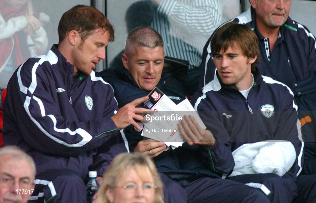 27 May 2005; Republic of Ireland players, left to right, Kenny Cunningham, Graham Kavanagh and Kevin Kilbane, watch on from the stands during the game. eircom League, Premier Division, Bohemians v Shelbourne, Dalymount Park, Dublin. Picture credit; David Maher / SPORTSFILE