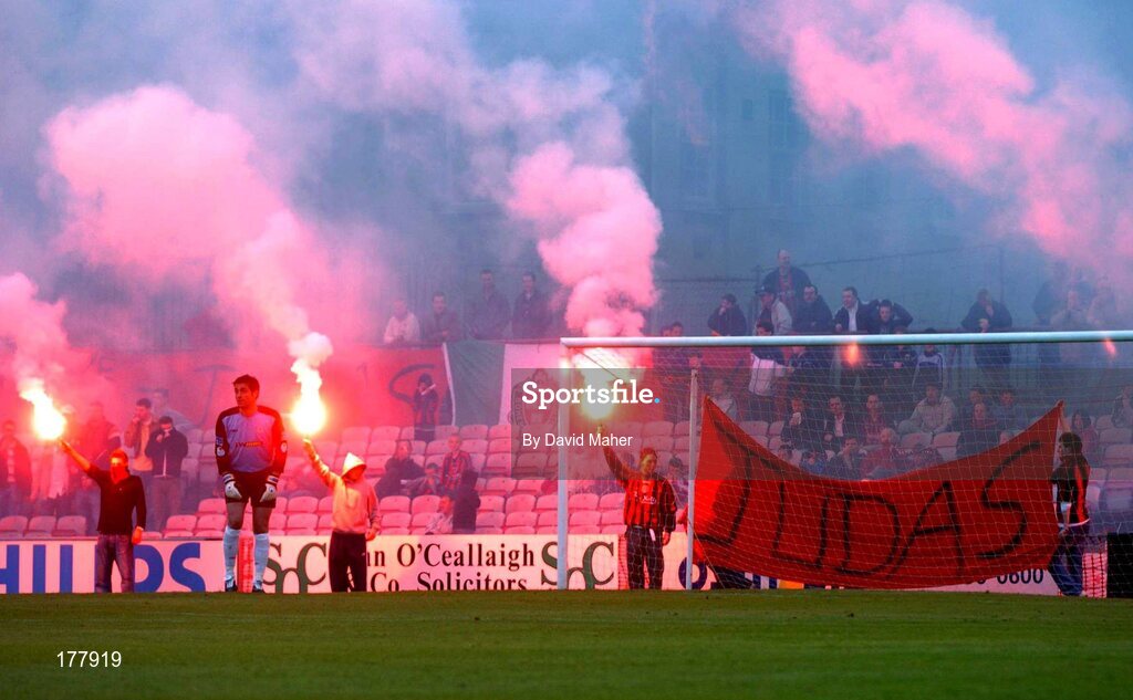 27 May 2005; Bohemians supporters hold up flares and a Judas flag, at the start of the second half, as Shelbourne goalkeeper Steve Williams looks on. eircom League, Premier Division, Bohemians v Shelbourne, Dalymount Park, Dublin. Picture credit; David Maher / SPORTSFILE