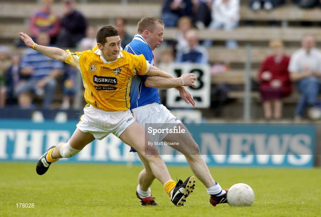 29 May 2005; Jason O'Reilly, Cavan, has a shot at goal despite the tackle of Damien Gault, Antrim. Bank of Ireland Ulster Senior Football Championship, Cavan v Antrim, Kingspan Breffni Park, Cavan. Picture credit; Matt Browne / SPORTSFILE
