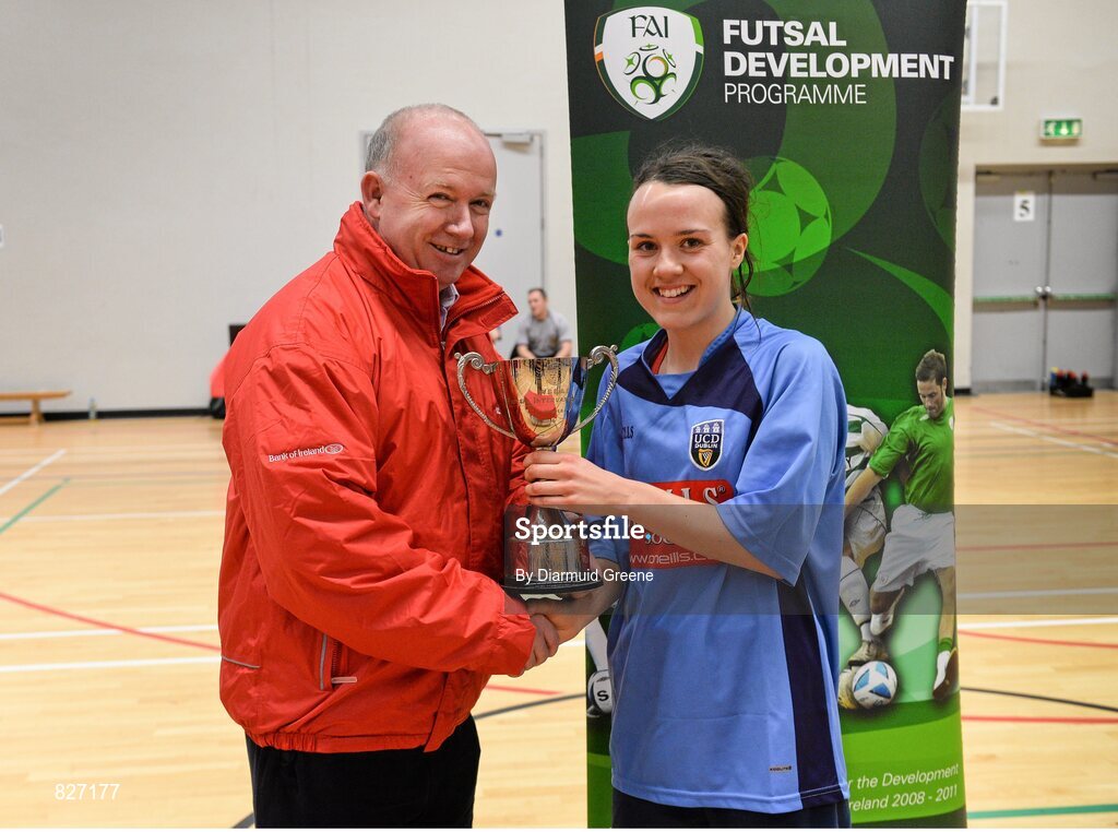 31 January 2014; UCD captain Ciara Grant is presented with the cup by UCC director of sport Declan Kidney. WSCAI National Futsal Final, UCD v Sligo IT, The Mardyke, UCC, Cork. Picture credit: Diarmuid Greene / SPORTSFILE