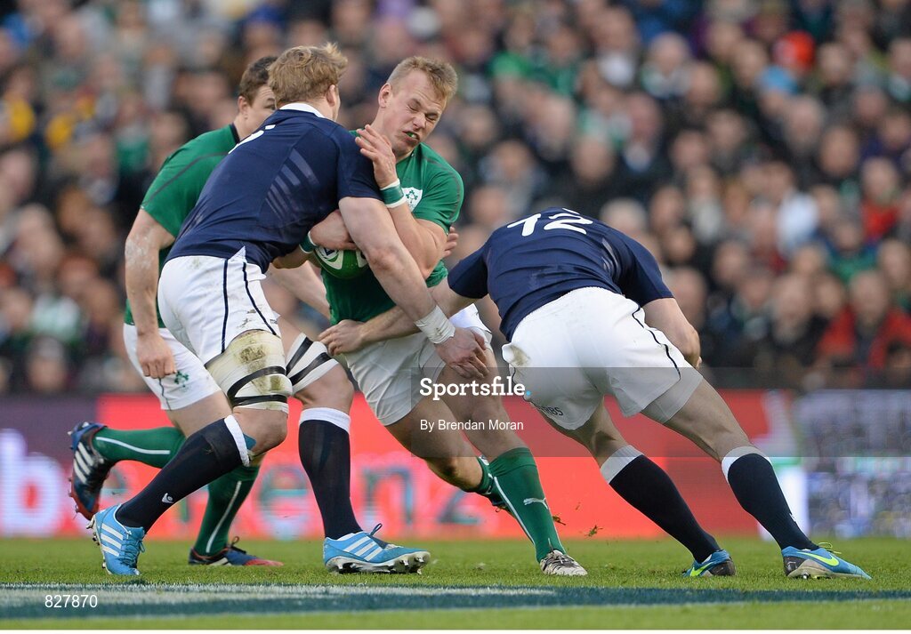 2 February 2014; Luke Marshall, Ireland, is tackled by David Denton, left, and Duncan Taylor, Scotland. RBS Six Nations Rugby Championship, Ireland v Scotland, Aviva Stadium, Lansdowne Road, Dublin. Picture credit: Brendan Moran / SPORTSFILE