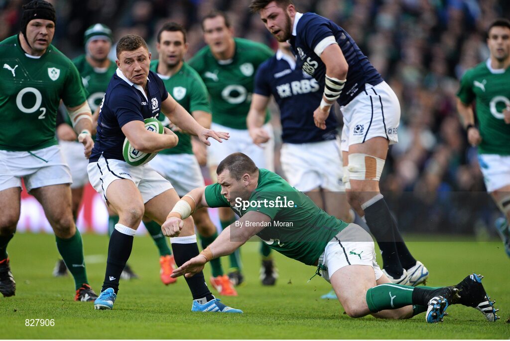2 February 2014; Duncan Weir, Scotland, evades the tackle of Ireland's Cian Healy. RBS Six Nations Rugby Championship, Ireland v Scotland, Aviva Stadium, Lansdowne Road, Dublin. Picture credit: Brendan Moran / SPORTSFILE
