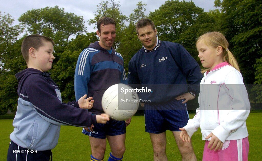 1 June 2005; "GPA and Energise Sport support first ever residential Gaelic Football Summer Camp." At the announcement are Dessie Farrell, Chief Executive of the GPA, and Enda McNulty, Armagh Footballer, with young footballers Lauren McConville, from Armagh, and Frankie Farrell, from Dublin. Castleknock College, Castleknock, Dublin. Picture credit; Damien Eagers / SPORTSFILE