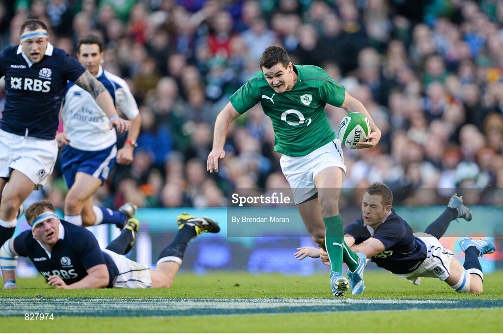2 February 2014; Jonathan Sexton, Ireland, breaks through the tackle of Scotland's Greig Laidlaw. RBS Six Nations Rugby Championship, Ireland v Scotland, Aviva Stadium, Lansdowne Road, Dublin. Picture credit: Brendan Moran / SPORTSFILE