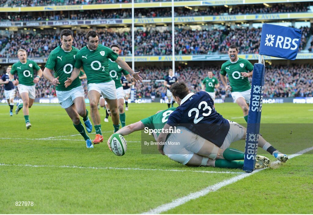 2 February 2014; Ireland's Jamie Heaslip steps into touch as he prepares to touch the ball down for a disallowed try under pressure from Scotland's Max Evans. RBS Six Nations Rugby Championship, Ireland v Scotland, Aviva Stadium, Lansdowne Road, Dublin. Picture credit: Brendan Moran / SPORTSFILE