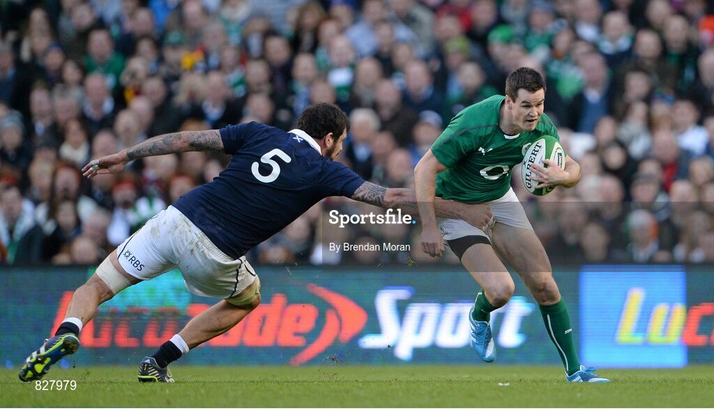 2 February 2014; Jonathan Sexton, Ireland, is tackled by Jim Hamilton, Scotland. RBS Six Nations Rugby Championship, Ireland v Scotland, Aviva Stadium, Lansdowne Road, Dublin. Picture credit: Brendan Moran / SPORTSFILE