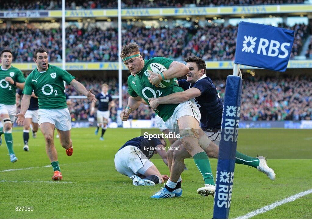 2 February 2014; Ireland's Jamie Heaslip is tackled by Scotland's Max Evans, as he makes his way towards the try line. RBS Six Nations Rugby Championship, Ireland v Scotland, Aviva Stadium, Lansdowne Road, Dublin. Picture credit: Brendan Moran / SPORTSFILE