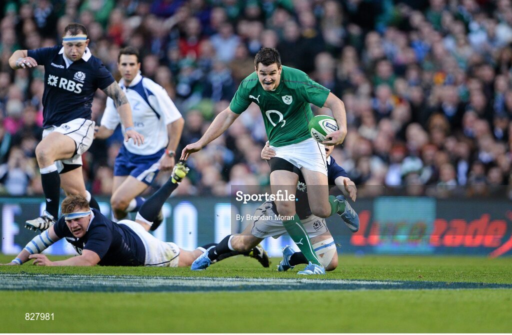 2 February 2014; Jonathan Sexton, Ireland, breaks through the tackle of Scotland's Greig Laidlaw. RBS Six Nations Rugby Championship, Ireland v Scotland, Aviva Stadium, Lansdowne Road, Dublin. Picture credit: Brendan Moran / SPORTSFILE