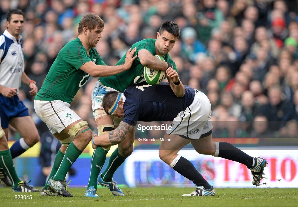 2 February 2014; Conor Murray, Ireland, with support from team-mate Chris Henry, is tackled by Kelly Brown, Scotland. RBS Six Nations Rugby Championship, Ireland v Scotland, Aviva Stadium, Lansdowne Road, Dublin. Picture credit: Brendan Moran / SPORTSFILE