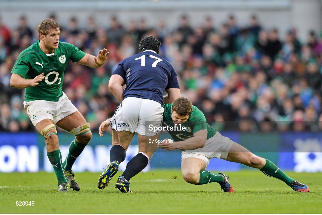 2 February 2014;Alasdair Dickinson, Scotland is tackled by Ireland's Brian O'Driscoll, as teammate Chris Henry, left, looks on. RBS Six Nations Rugby Championship, Ireland v Scotland, Aviva Stadium, Lansdowne Road, Dublin. Photo by Sportsfile