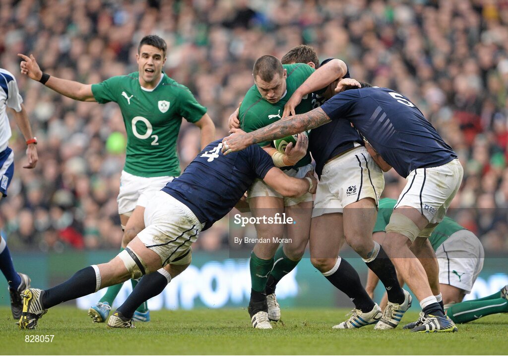 2 February 2014; Cian Healy, Ireland, is tackled by Tim Swinson, left, and Jim Hamilton, Scotland. RBS Six Nations Rugby Championship, Ireland v Scotland, Aviva Stadium, Lansdowne Road, Dublin. Picture credit: Brendan Moran / SPORTSFILE