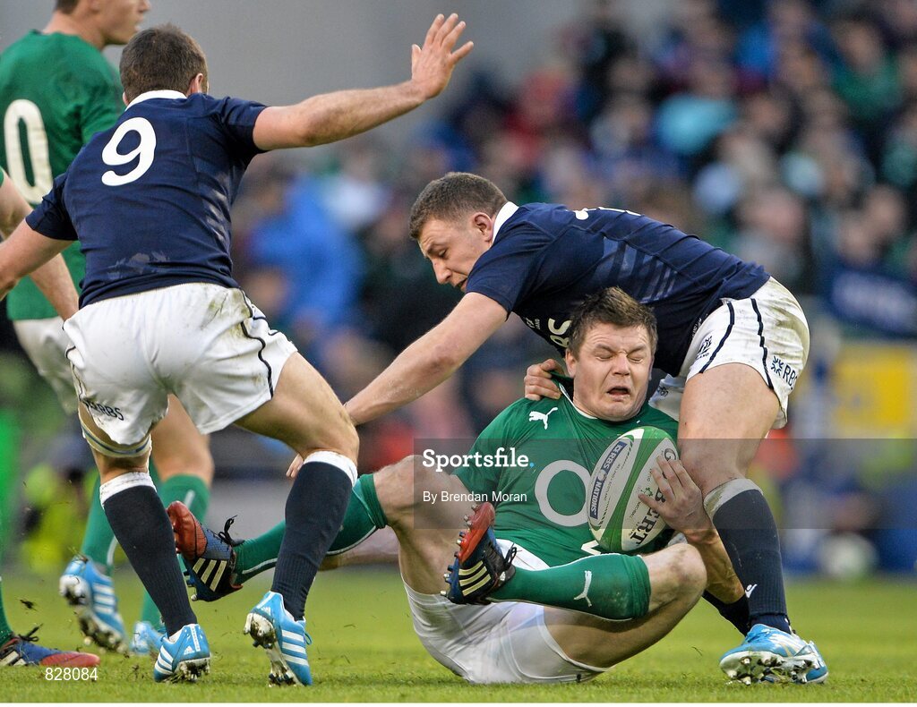 2 February 2014; Brian O'Driscoll, Ireland, is tackled by Duncan Weir, Scotland. RBS Six Nations Rugby Championship, Ireland v Scotland, Aviva Stadium, Lansdowne Road, Dublin. Picture credit: Brendan Moran / SPORTSFILE