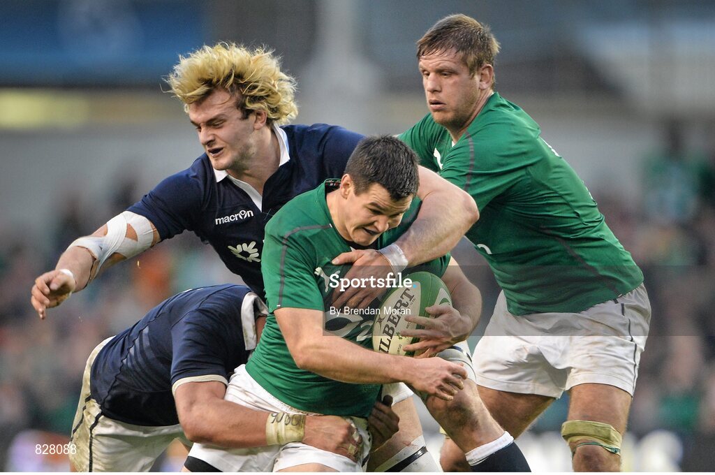 2 February 2014; Jonathan Sexton, Ireland, supported by teammate Chris Henry is tackled by Scotland's Ryan Wilson and Richie Gray. RBS Six Nations Rugby Championship, Ireland v Scotland, Aviva Stadium, Lansdowne Road, Dublin. Picture credit: Brendan Moran / SPORTSFILE