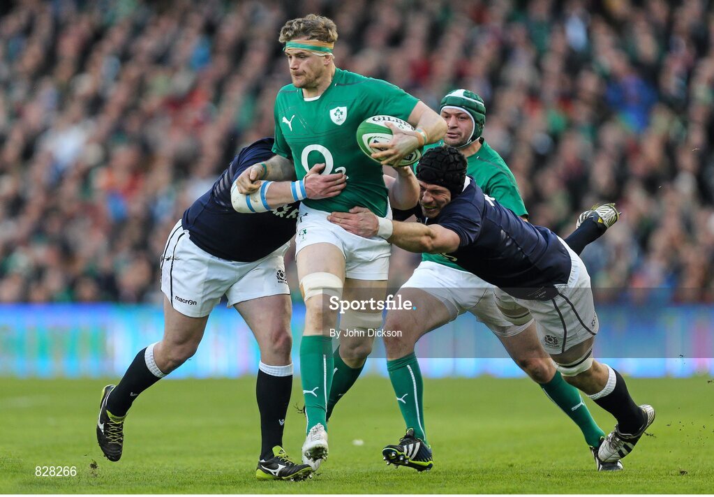 2 February 2014; Jamie Heaslip, Ireland, is tackled by Moray Low and Tim Swinson, Scotland. RBS Six Nations Rugby Championship, Ireland v Scotland, Aviva Stadium, Lansdowne Road, Dublin. Picture credit: John Dickson / SPORTSFILE