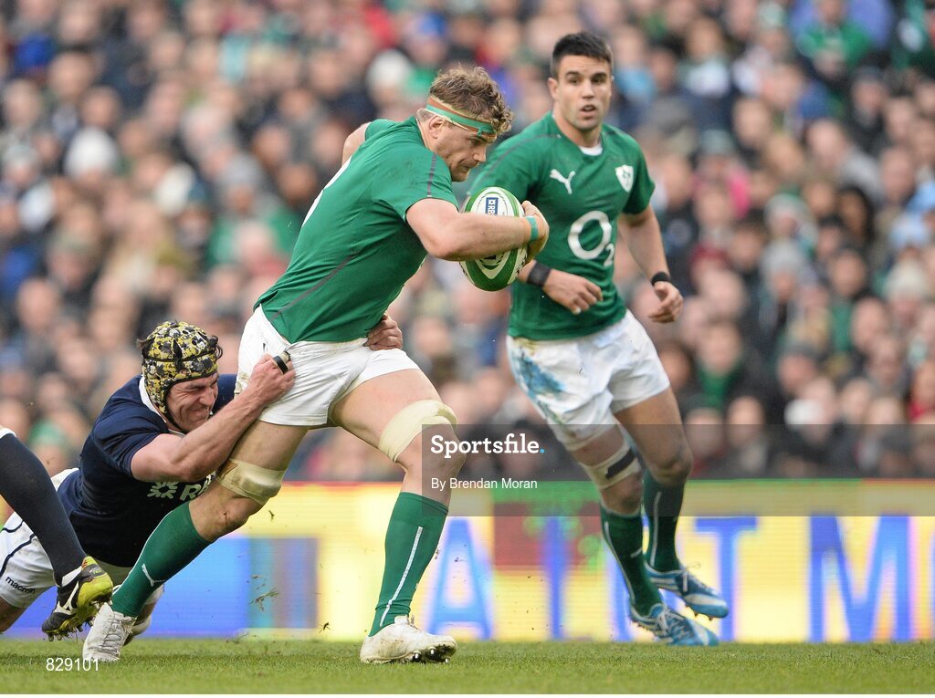 2 February 2014; Jamie Heaslip, Ireland, is tackled by Kelly Brown, Scotland. RBS Six Nations Rugby Championship, Ireland v Scotland, Aviva Stadium, Lansdowne Road, Dublin. Picture credit: Brendan Moran / SPORTSFILE