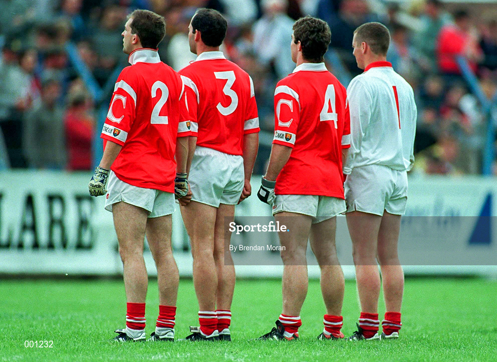 22 June 1997; From left to right, Brian Murphy, Mark O'Connor, Eoin Sexton and Kevin O'Dwyer of Cork stand for the national anthem prior to the GAA Munster Senior Football Championship Semi-Final match between Clare and Cork at Cusack Park in Ennis, Clare. Photo by Brendan Moran/Sportsfile