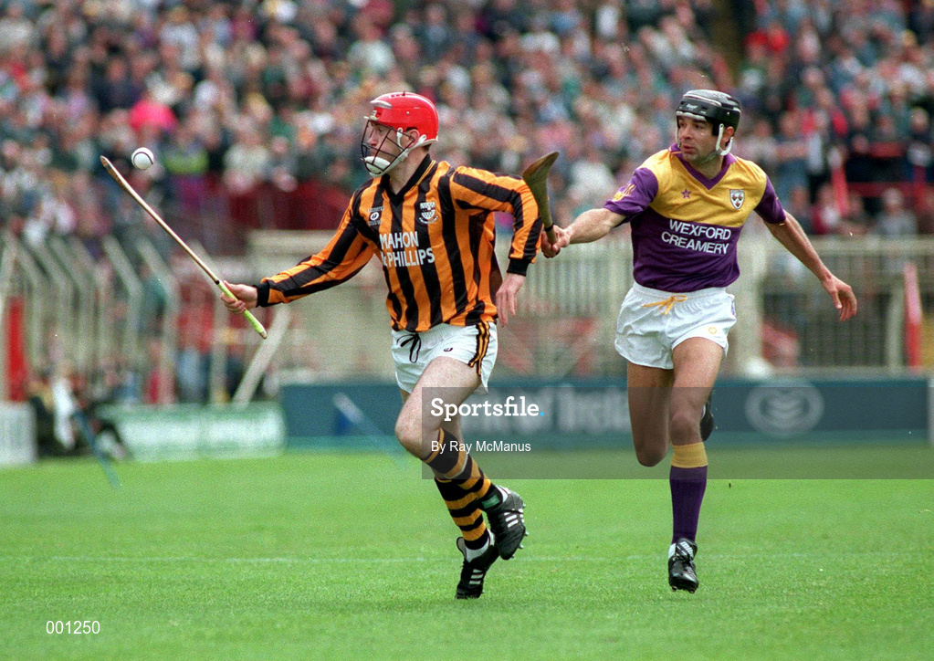 11 July 1993; Eammon Morrissey of Kilkenny in action against John O'Connor of Wexford during the Leinster Senior Hurling Championship Final match between Kilkenny and Wexford at Croke Park in Dublin. Photo by Ray McManus/Sportsfile