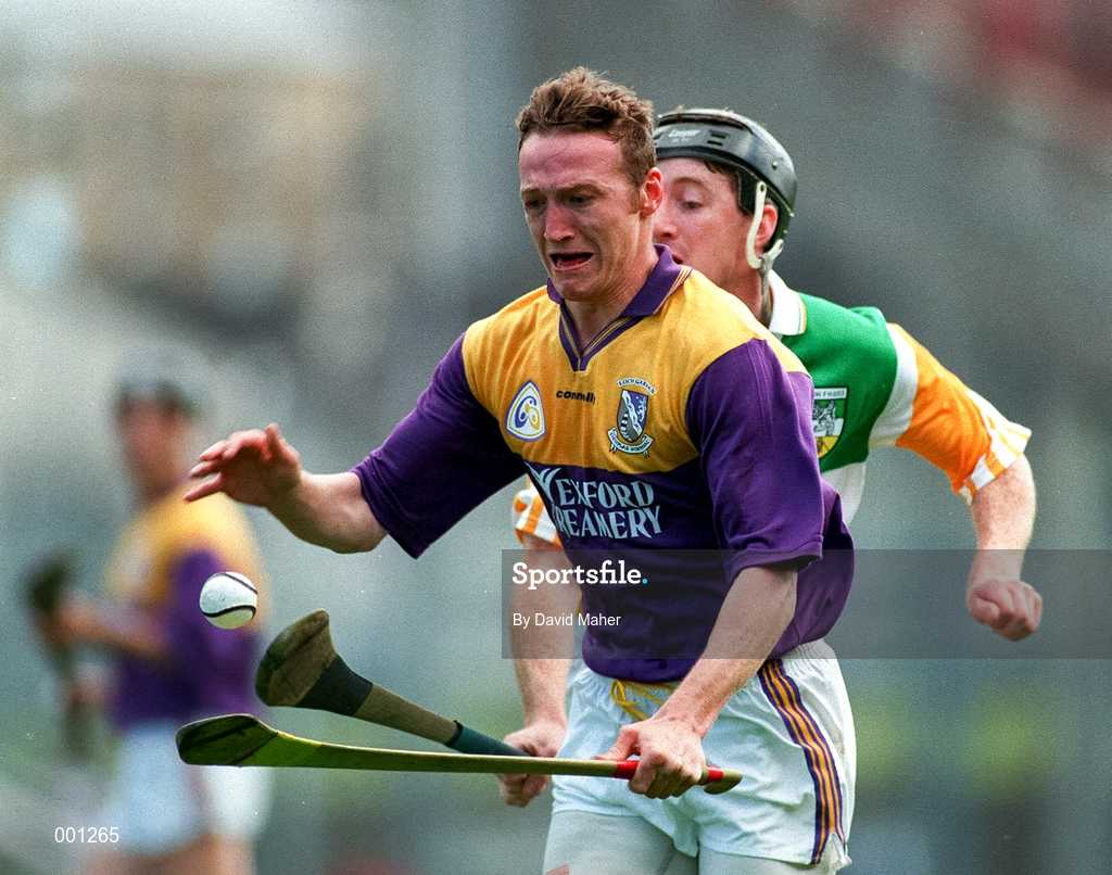 23 March 1997; Larry Murphy of Wexford in action against Brian Whelahan of Offaly during the National Hurling League Division 1 match between Offaly and Wexford at St. Brendan's Park in Birr, Offaly. Photo by David Maher/Sportsfile